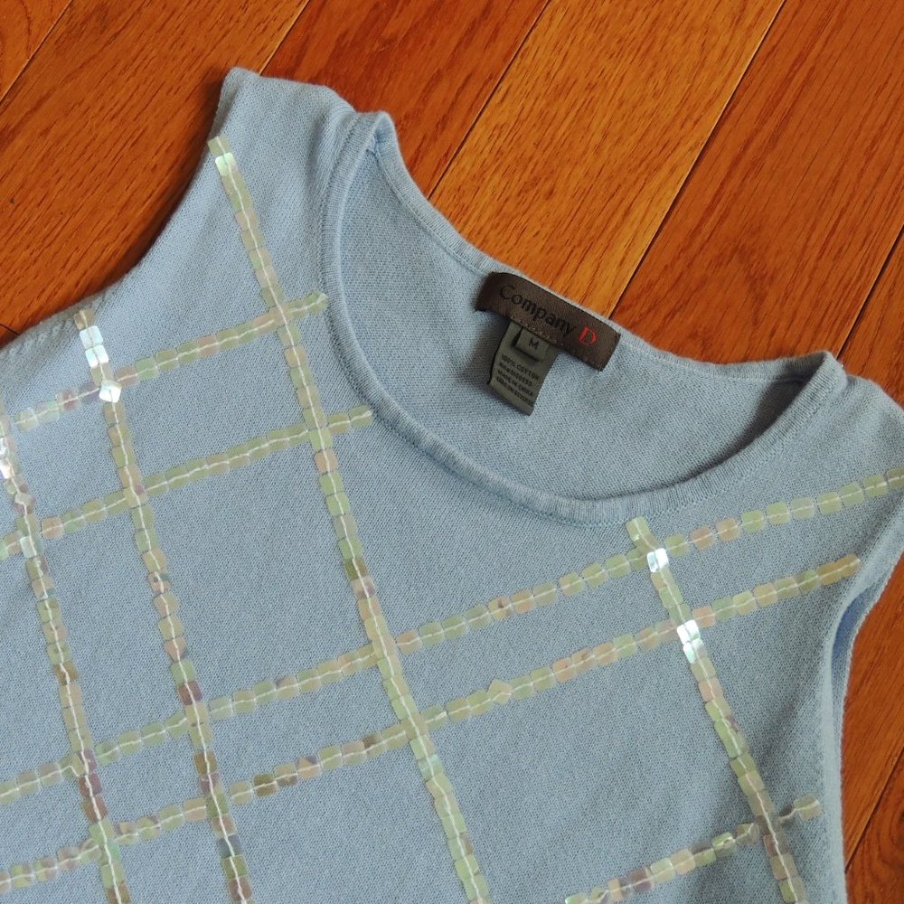 Embellished light blue sweater vest.